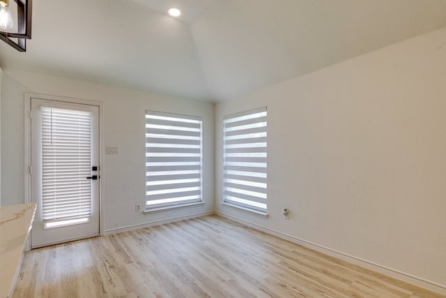 15525 Western Trl, Frisco, TX 75035 - empty room with vaulted ceiling, light wood-style flooring, and baseboards