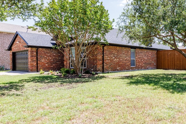 15525 Western Trl, Frisco, TX 75035 - view of front of home with an attached garage, brick siding, and a front yard