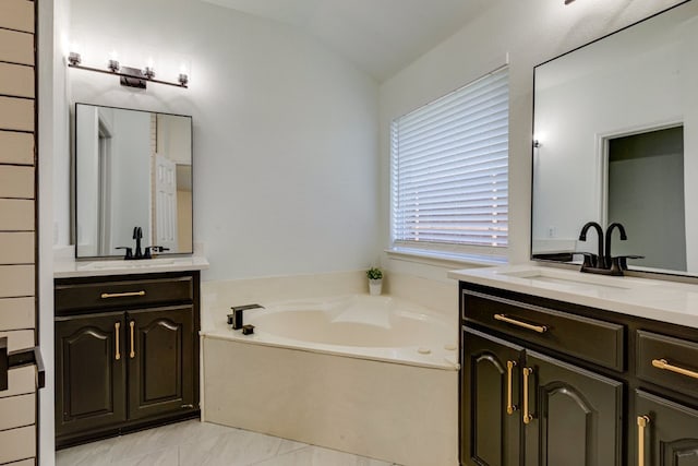 15525 Western Trl, Frisco, TX 75035 - full bathroom with two vanities, a garden tub, and lofted ceiling