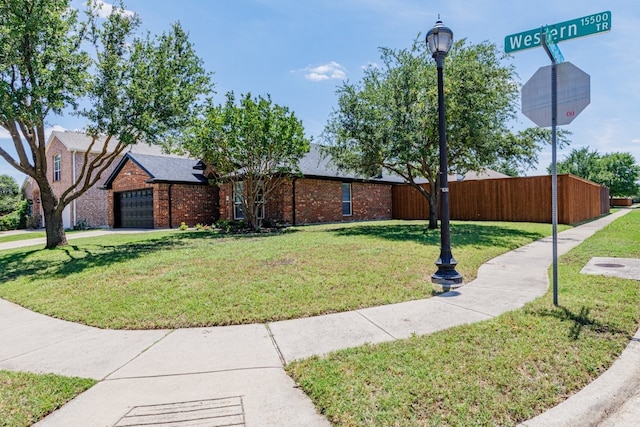 15525 Western Trl, Frisco, TX 75035 - view of side of property with brick siding and concrete driveway
