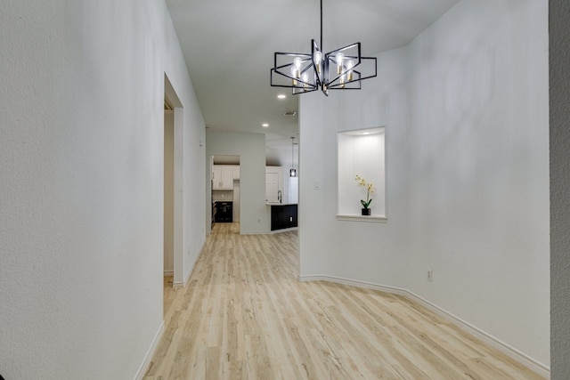 15525 Western Trl, Frisco, TX 75035 - hall with light wood finished floors, baseboards, a chandelier, and recessed lighting