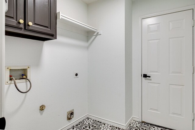 15525 Western Trl, Frisco, TX 75035 - laundry room featuring electric dryer hookup, cabinet space, washer hookup, and baseboards