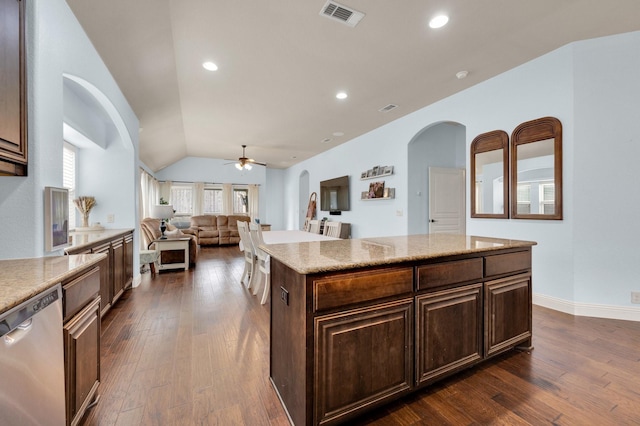 3214 Paisley Dr, Midlothian, TX 76065 - kitchen featuring stainless steel dishwasher, arched walkways, a ceiling fan, dark wood-style flooring, and vaulted ceiling