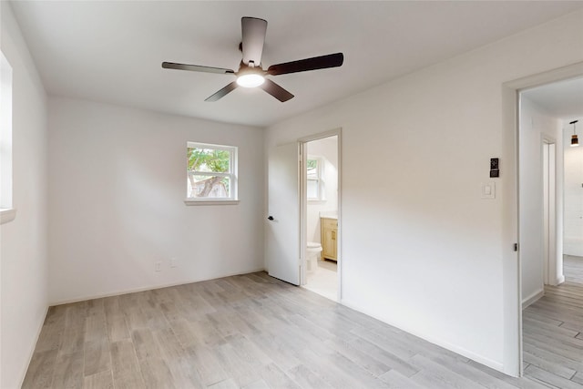 409 Fleming Dr, Hurst, TX 76053 - empty room with ceiling fan and light wood-style floors