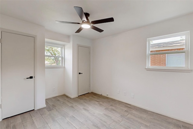 409 Fleming Dr, Hurst, TX 76053 - unfurnished bedroom with light wood-style floors and ceiling fan