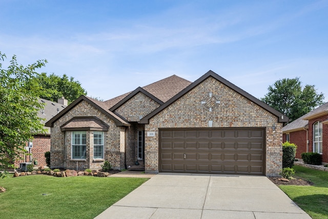 308 Wrangler Dr, Fairview, TX 75069 - french country inspired facade featuring brick siding, concrete driveway, a front yard, a garage, and roof with shingles