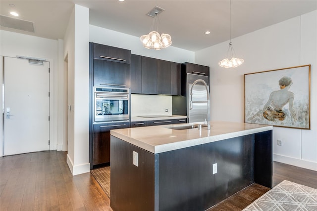 2200 Victory Ave Unit 701, Dallas, TX 75219 - kitchen featuring a chandelier, stainless steel oven, light countertops, modern cabinets, and recessed lighting