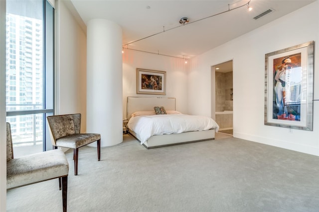 2200 Victory Ave Unit 701, Dallas, TX 75219 - carpeted bedroom featuring connected bathroom
