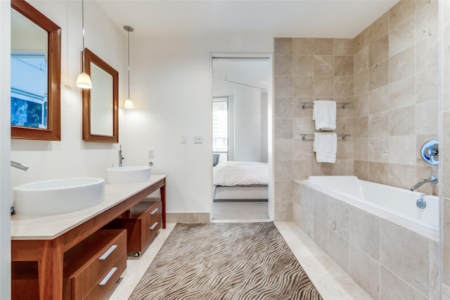 2200 Victory Ave Unit 701, Dallas, TX 75219 - ensuite bathroom featuring double vanity and tiled tub