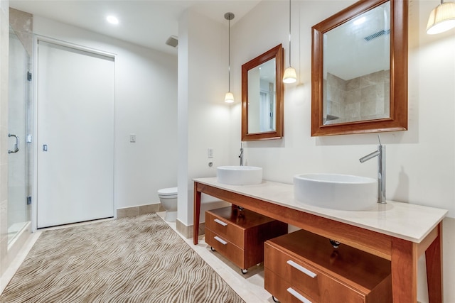 2200 Victory Ave Unit 701, Dallas, TX 75219 - full bath with a stall shower, double vanity, and toilet
