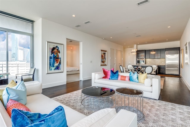 2200 Victory Ave Unit 701, Dallas, TX 75219 - living area with wood finished floors, baseboards, and recessed lighting