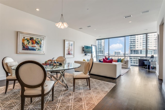 2200 Victory Ave Unit 701, Dallas, TX 75219 - dining room with wood finished floors, a chandelier, expansive windows, and recessed lighting