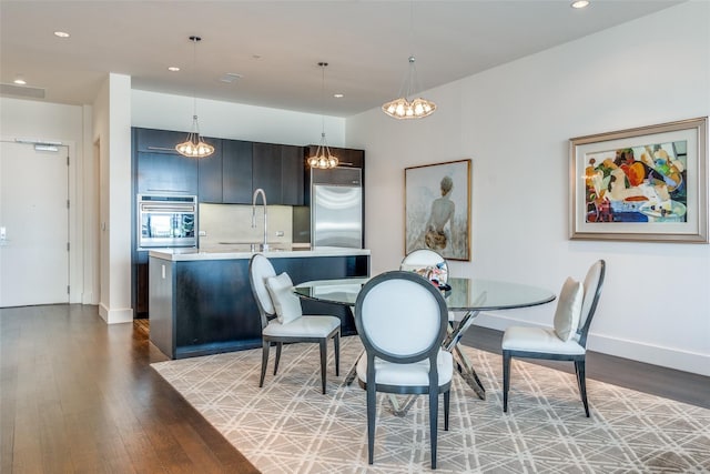 2200 Victory Ave Unit 701, Dallas, TX 75219 - dining area with light wood-style flooring, recessed lighting, baseboards, and a chandelier