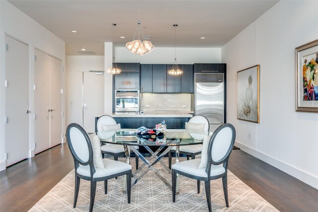 2200 Victory Ave Unit 701, Dallas, TX 75219 - dining room featuring wood finished floors, a chandelier, recessed lighting, and baseboards