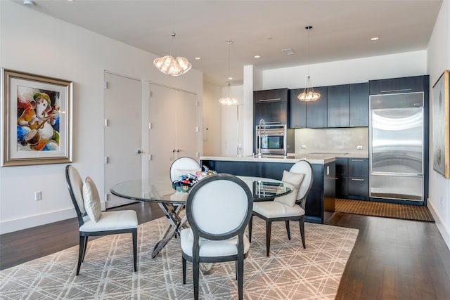 2200 Victory Ave Unit 701, Dallas, TX 75219 - dining space featuring wood finished floors, baseboards, a chandelier, and recessed lighting