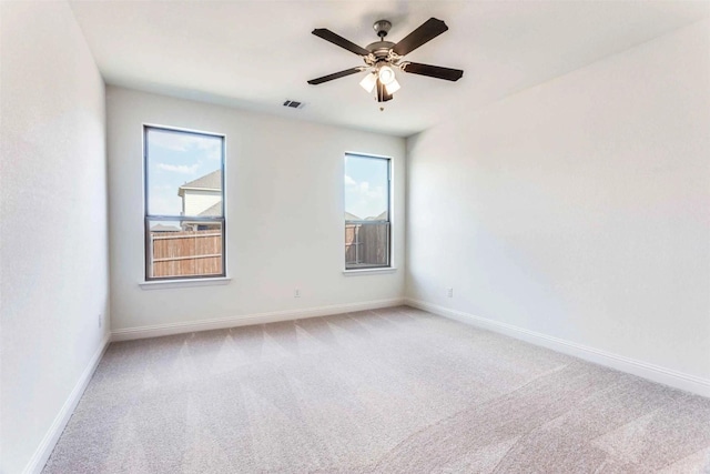 533 Hillcrest Cir, Justin, TX 76247 - unfurnished room with light colored carpet, baseboards, and a ceiling fan