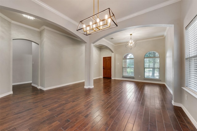 13293 Grayhawk Blvd, Frisco, TX 75033 - unfurnished room with dark wood-style flooring, arched walkways, baseboards, a chandelier, and crown molding