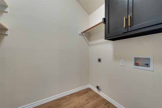 13293 Grayhawk Blvd, Frisco, TX 75033 - laundry room with electric dryer hookup, cabinet space, wood finished floors, hookup for a washing machine, and baseboards