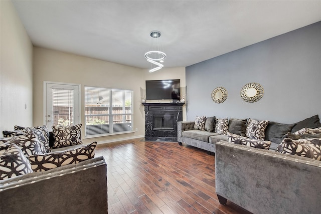 13293 Grayhawk Blvd, Frisco, TX 75033 - living area featuring a premium fireplace and dark wood-type flooring