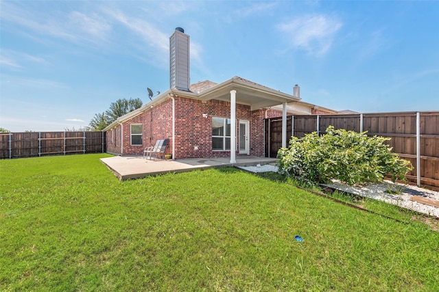 13293 Grayhawk Blvd, Frisco, TX 75033 - rear view of house featuring brick siding, a chimney, and a patio