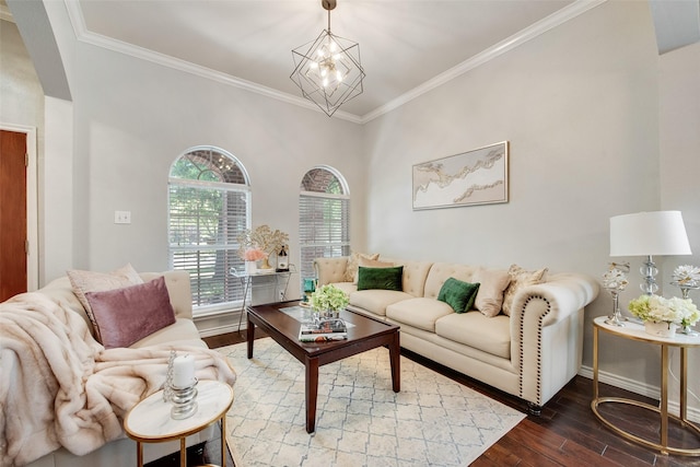13293 Grayhawk Blvd, Frisco, TX 75033 - living area featuring hardwood / wood-style flooring, ornamental molding, baseboards, arched walkways, and a chandelier