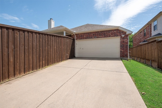 13293 Grayhawk Blvd, Frisco, TX 75033 - view of side of property featuring brick siding, driveway, a garage, and a shingled roof