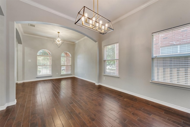 13293 Grayhawk Blvd, Frisco, TX 75033 - unfurnished room with arched walkways, a chandelier, healthy amount of natural light, dark wood finished floors, and ornamental molding