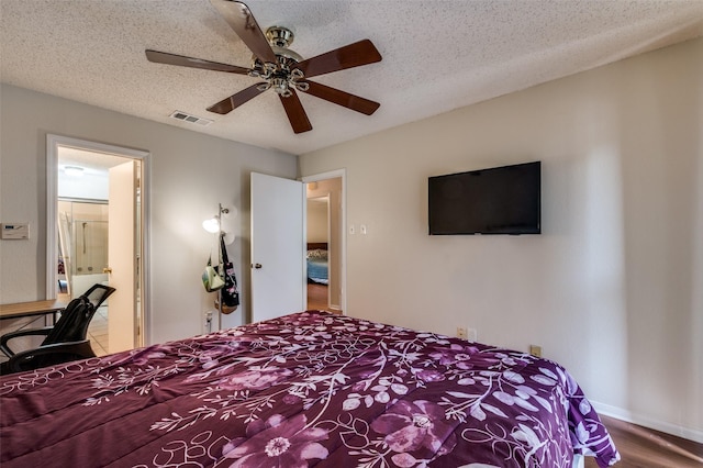 1301 Memory Ln Unit 4920, Arlington, TX 76011 - bedroom with wood finished floors, a ceiling fan, and a textured ceiling