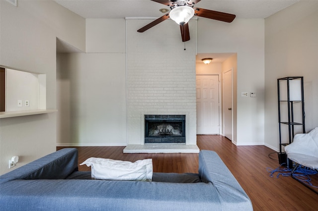 1301 Memory Ln Unit 4920, Arlington, TX 76011 - living room with a high ceiling, ceiling fan, wood finished floors, a fireplace, and baseboards