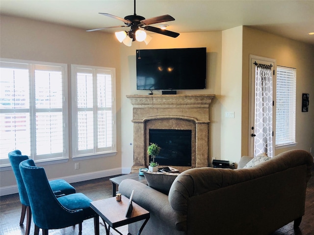 5029 E Province Pl, Irving, TX 75038 - living area with dark wood-type flooring, baseboards, a ceiling fan, and healthy amount of natural light