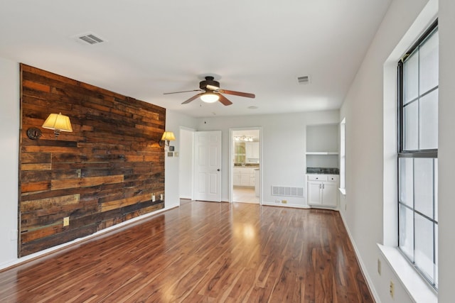 2224 Bluff Ct, Cedar Hill, TX 75104 - unfurnished living room featuring ceiling fan, wood finished floors, and baseboards