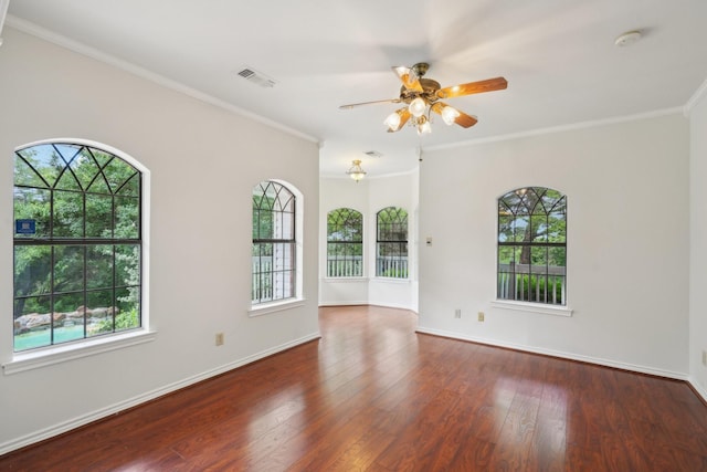 2224 Bluff Ct, Cedar Hill, TX 75104 - empty room featuring ceiling fan, plenty of natural light, wood finished floors, baseboards, and crown molding