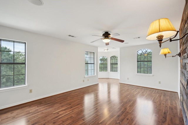 2224 Bluff Ct, Cedar Hill, TX 75104 - unfurnished room featuring ceiling fan, wood finished floors, baseboards, and a stone fireplace