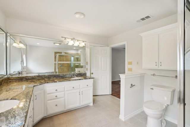 2224 Bluff Ct, Cedar Hill, TX 75104 - bathroom featuring double vanity, a shower stall, toilet, and tile patterned flooring