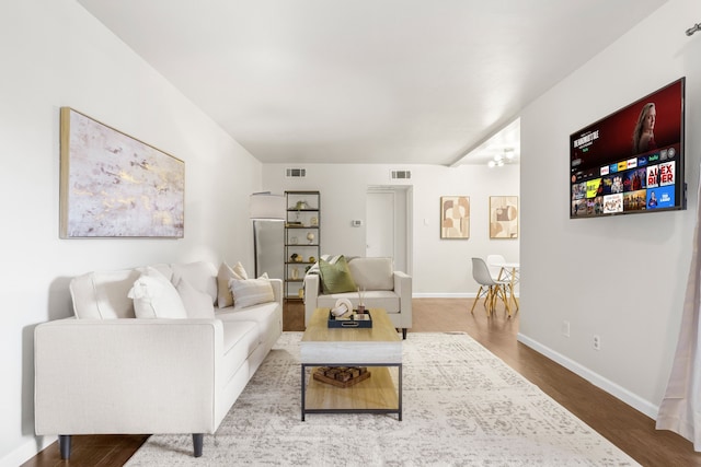 2800 Escada Dr Unit 207, Farmers Branch, TX 75234 - living room featuring baseboards, wood finished floors, and a chandelier