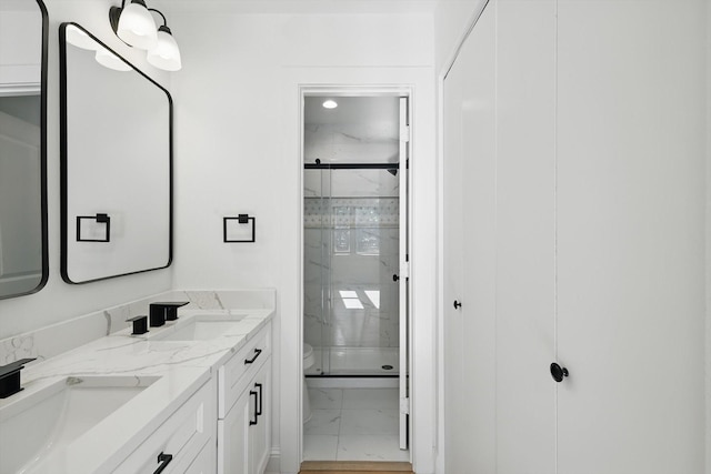 10626 Desdemona Dr, Dallas, TX 75228 - bathroom featuring marble finish floors, toilet, a marble finish shower, and double vanity