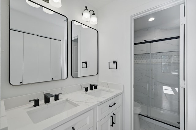 10626 Desdemona Dr, Dallas, TX 75228 - full bathroom with marble finish floors, a marble finish shower, double vanity, and toilet