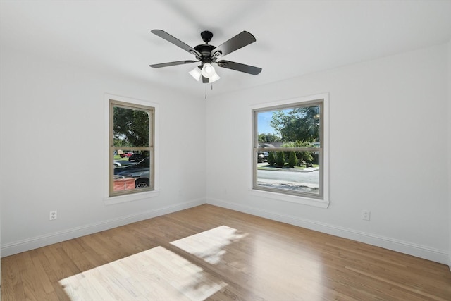 10626 Desdemona Dr, Dallas, TX 75228 - spare room featuring wood finished floors, baseboards, and ceiling fan