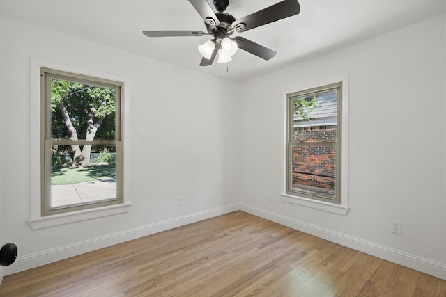 10626 Desdemona Dr, Dallas, TX 75228 - empty room featuring light wood finished floors, healthy amount of natural light, baseboards, and a ceiling fan