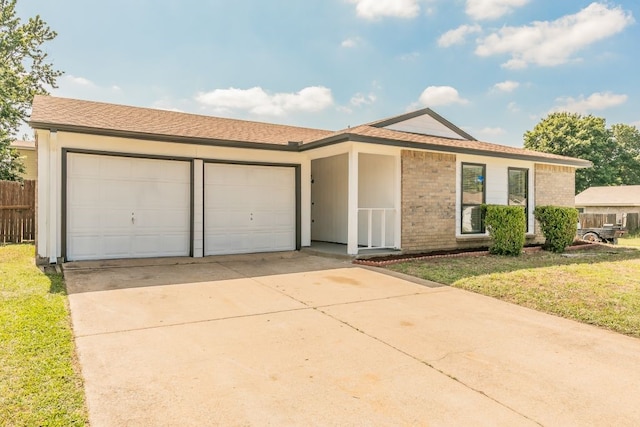 2400 Clearwood Dr, Arlington, TX 76014 - ranch-style home with an attached garage, driveway, and brick siding