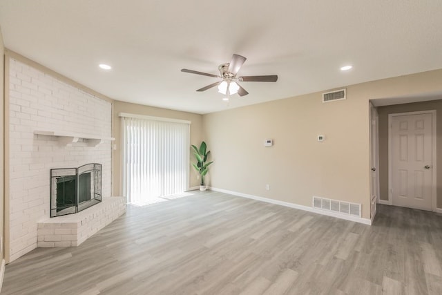 2400 Clearwood Dr, Arlington, TX 76014 - unfurnished living room with a ceiling fan, light wood-style flooring, baseboards, recessed lighting, and a brick fireplace