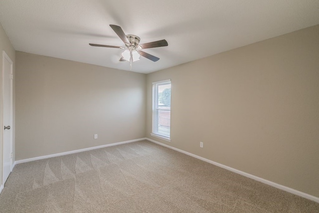 2400 Clearwood Dr, Arlington, TX 76014 - unfurnished room with light carpet, baseboards, and a ceiling fan