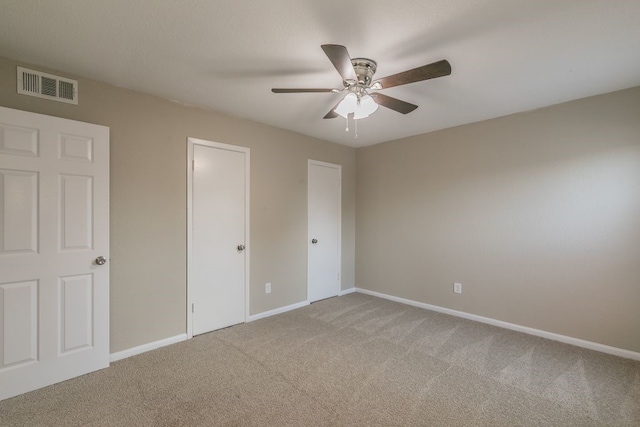 2400 Clearwood Dr, Arlington, TX 76014 - unfurnished bedroom featuring light colored carpet, baseboards, and a ceiling fan