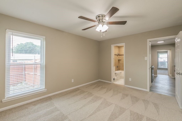 2400 Clearwood Dr, Arlington, TX 76014 - unfurnished bedroom featuring carpet, baseboards, connected bathroom, and ceiling fan