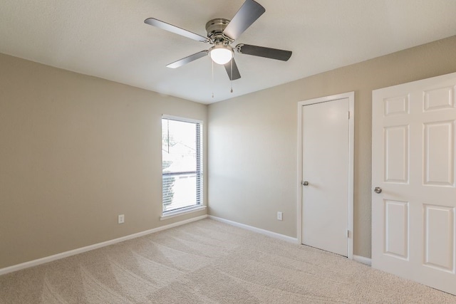 2400 Clearwood Dr, Arlington, TX 76014 - unfurnished bedroom featuring carpet, baseboards, and a ceiling fan