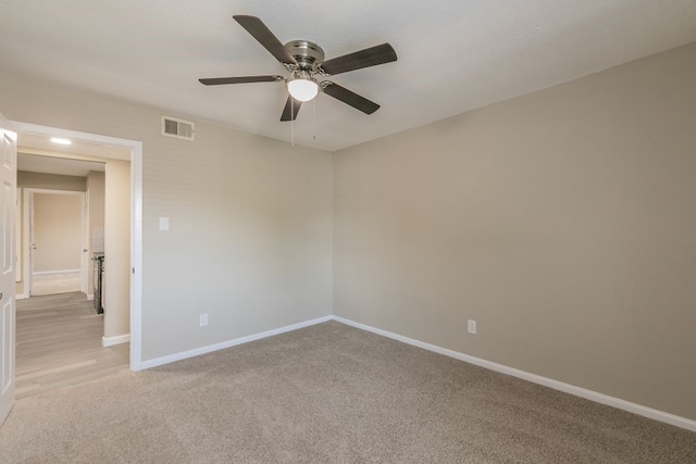 2400 Clearwood Dr, Arlington, TX 76014 - unfurnished room with a ceiling fan, light carpet, and baseboards