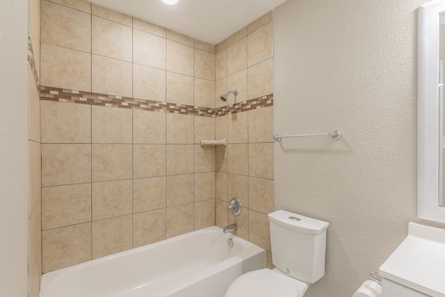 2400 Clearwood Dr, Arlington, TX 76014 - full bathroom with toilet, vanity, shower / bathtub combination, and a textured wall