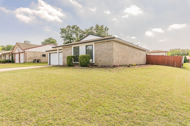 2400 Clearwood Dr, Arlington, TX 76014 - view of front facade featuring an attached garage, brick siding, and driveway