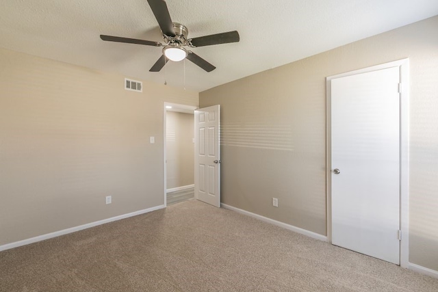 2400 Clearwood Dr, Arlington, TX 76014 - unfurnished bedroom featuring light carpet, baseboards, and a ceiling fan