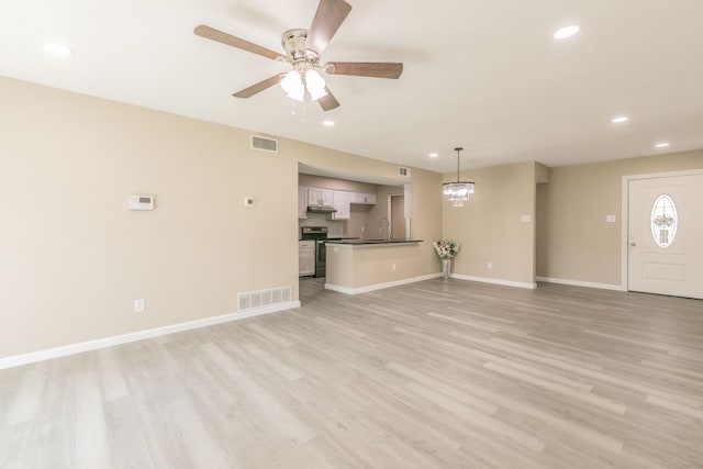 2400 Clearwood Dr, Arlington, TX 76014 - unfurnished living room featuring recessed lighting, ceiling fan, a sink, light wood-style floors, and baseboards